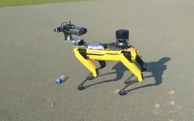 A collection robot spotting a plastic bottle on the ground and moving toward it
